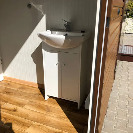 Contenedor sanitario con revestimiento exterior efecto madera.